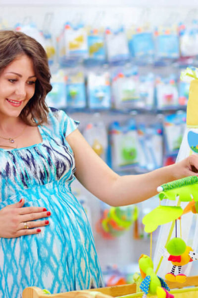 Pregnant mom to be shopping for baby gear and making the most of her baby registry