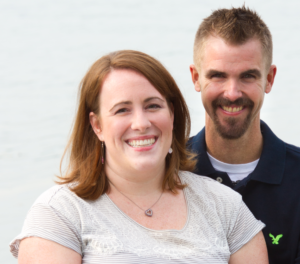 Woman with auburn hair and man with brown hair and beard