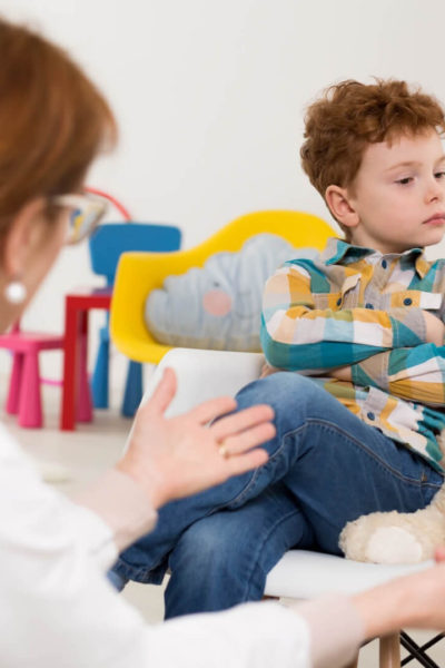 Teacher trying to calm an upset boy.