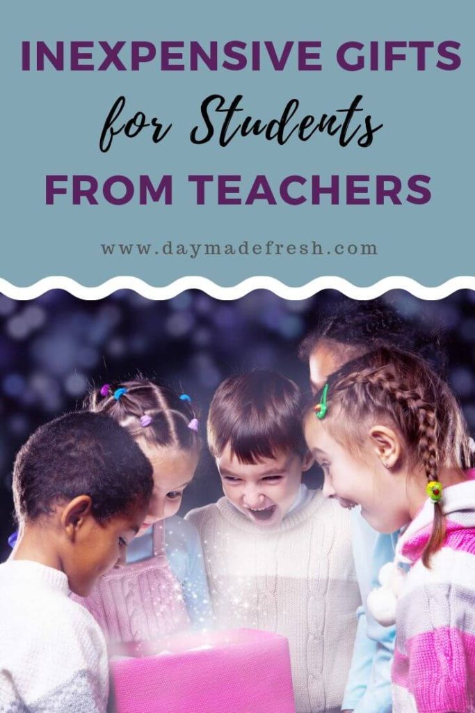 Inexpensive Gifts for Students From Teachers: A Group of 5 Kids looking at a pink gift