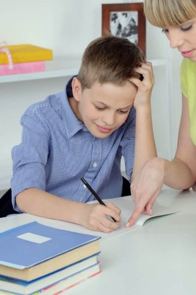 Frustrated elementary student trying to complete their work