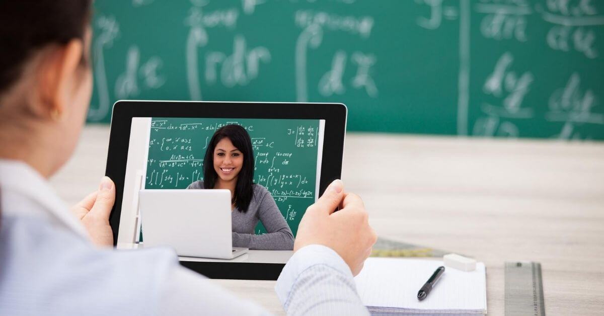 Student watching a teacher teach virtually