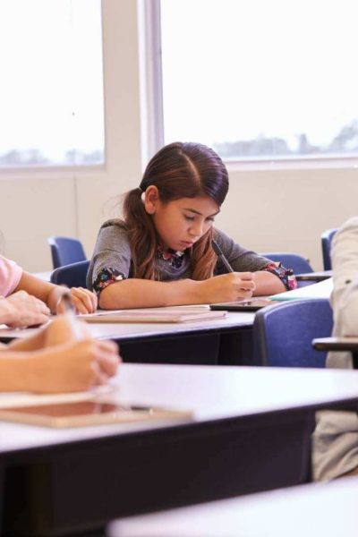 Elementary students working independently at their desks during transition time